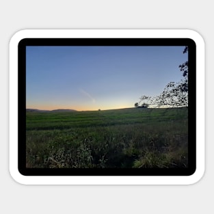 Sunset over the field Sticker